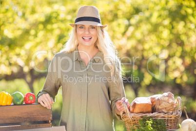 Blonde smiling over a table of organic food