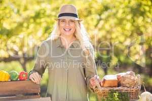 Blonde smiling over a table of organic food