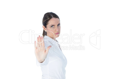 Businesswoman doing stop with palm