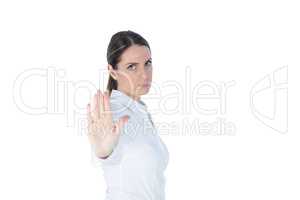 Businesswoman doing stop with palm