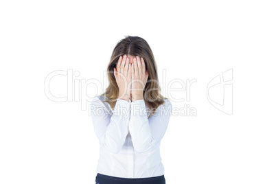 Anxious businesswoman with head in hands