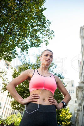 Portrait of a beautiful athlete with her hands on her hips