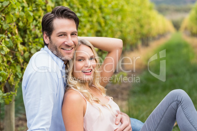 Young happy man embracing his girlfriend