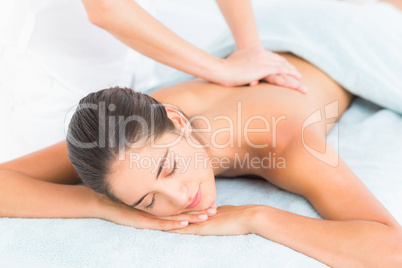 Beautiful brunette enjoying a massage