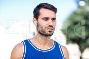 An handsome athlete looking away