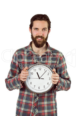 Handsome hipster showing a clock Handsome hipster showing a clock