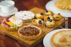 Close up wooden tray of tasty pastries