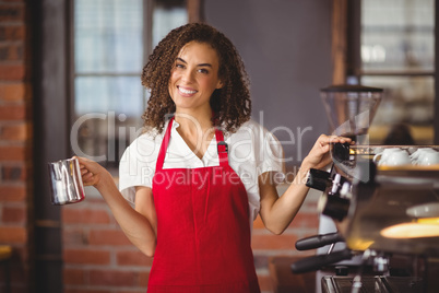 A pretty waitress holding a jug