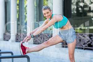 A beautiful woman stretching her leg