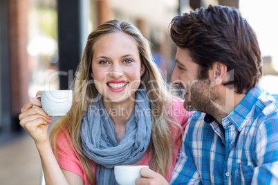 Cute couple having coffee together