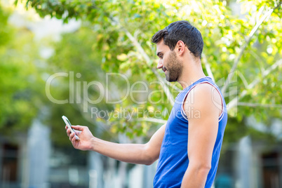 An happy handsome athlete taking a selfie