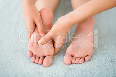 Close-up of a woman receiving foot massage