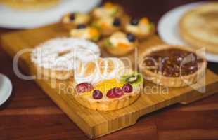 Close up wooden tray of tasty pastries