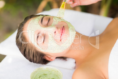 Attractive woman receiving treatment at spa center