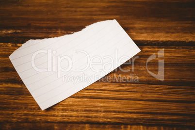 Scrap of paper on wooden table