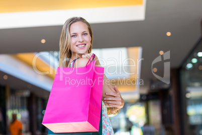 Smiling woman with shopping bags