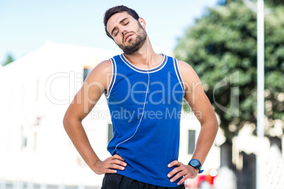 An handsome athlete stretching his neck