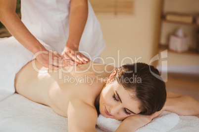 Young woman getting back massage