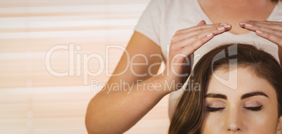 Young woman having a reiki treatment