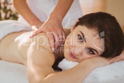 Young woman getting shoulder massage