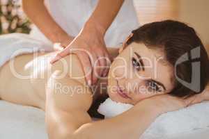 Young woman getting shoulder massage