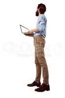 Handsome hipster holding a laptop