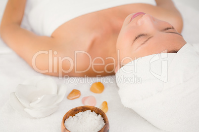 Relaxed woman lying on the massage table