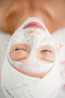 Attractive woman with cream treatment