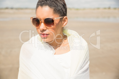 Stylish woman wrapped in scarf