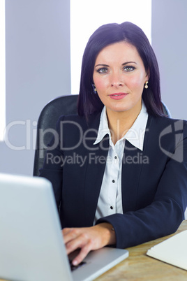 Businesswoman working at her desk