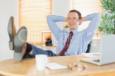 Relaxed businessman with his feet up