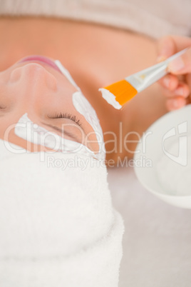 Attractive woman receiving treatment at spa center