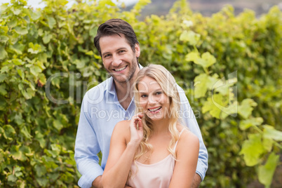 Young happy couple smiling at camera