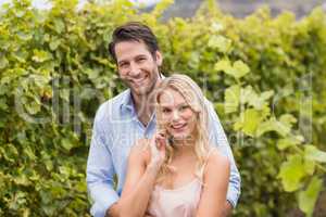 Young happy couple smiling at camera