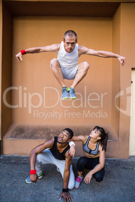 Group of people doing parkour in the city