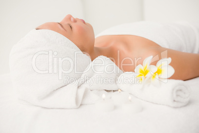 Relaxed woman lying on the massage table