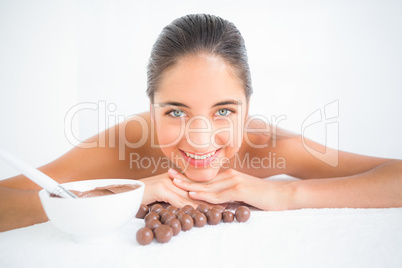 Beautiful brunette enjoying a chocolate beauty treatment