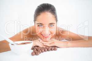 Beautiful brunette enjoying a chocolate beauty treatment