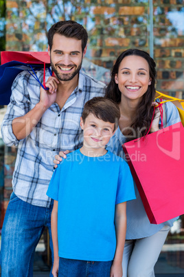 Portrait of a happy family having fun in the mall