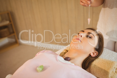 Young woman at crystal healing session
