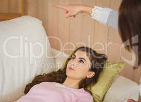 Hypnotherapist hypnotizing her young patient