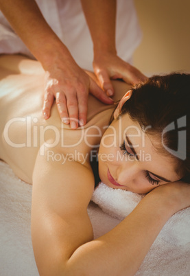 Young woman getting back massage