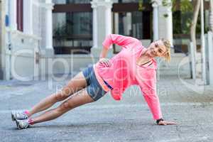 Pretty woman planking on the floor