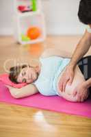 Pregnant woman getting massage for pregnant belly