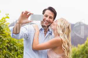 Young happy couple taking a selfie