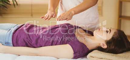 Young woman having a reiki treatment