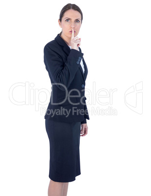 Pretty businesswoman asking for silence