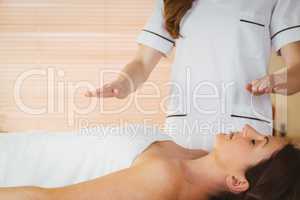 Young woman having a reiki treatment