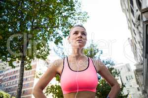 Portrait of a beautiful athlete with her hands on her hips