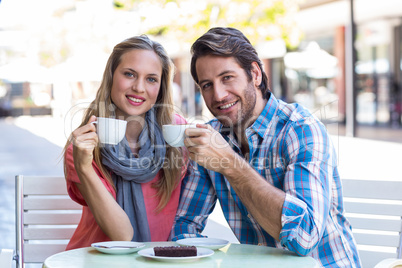 Cute couple having coffee together